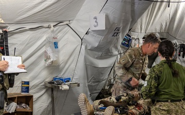 Global Medic Personnel Treat Simulated Casualty