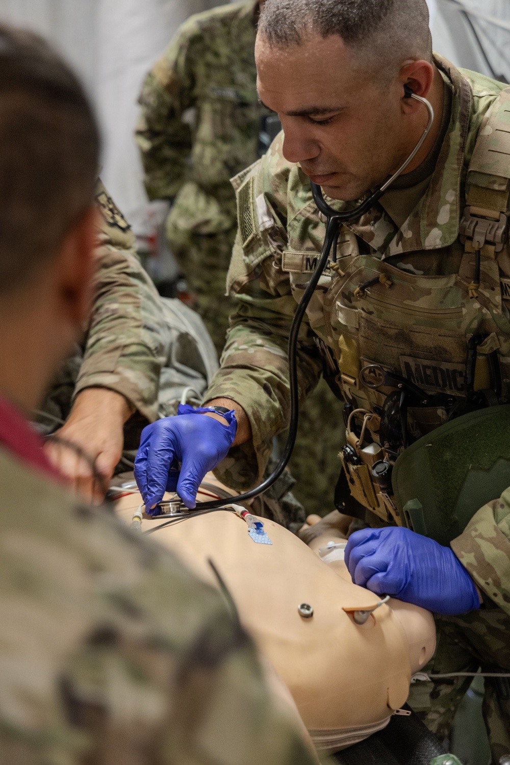 Global Medic Personnel Treat Simulated Casualty