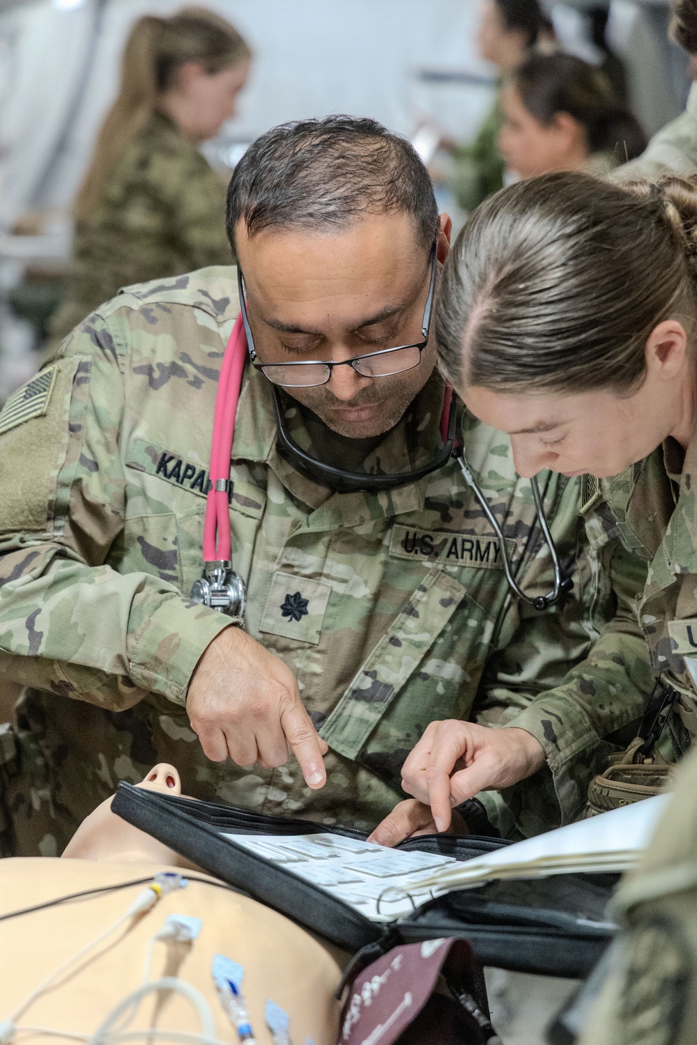 Global Medic Personnel Treat Simulated Casualty