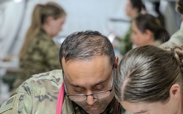 Global Medic Personnel Treat Simulated Casualty