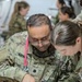 Global Medic Personnel Treat Simulated Casualty