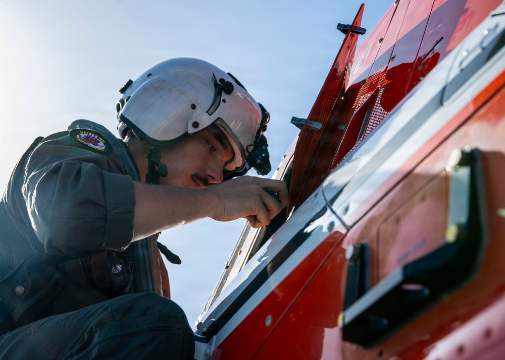 HT-28 Student Naval Aviator Performs Pre-Flight Inspection of TH-73A Thrasher