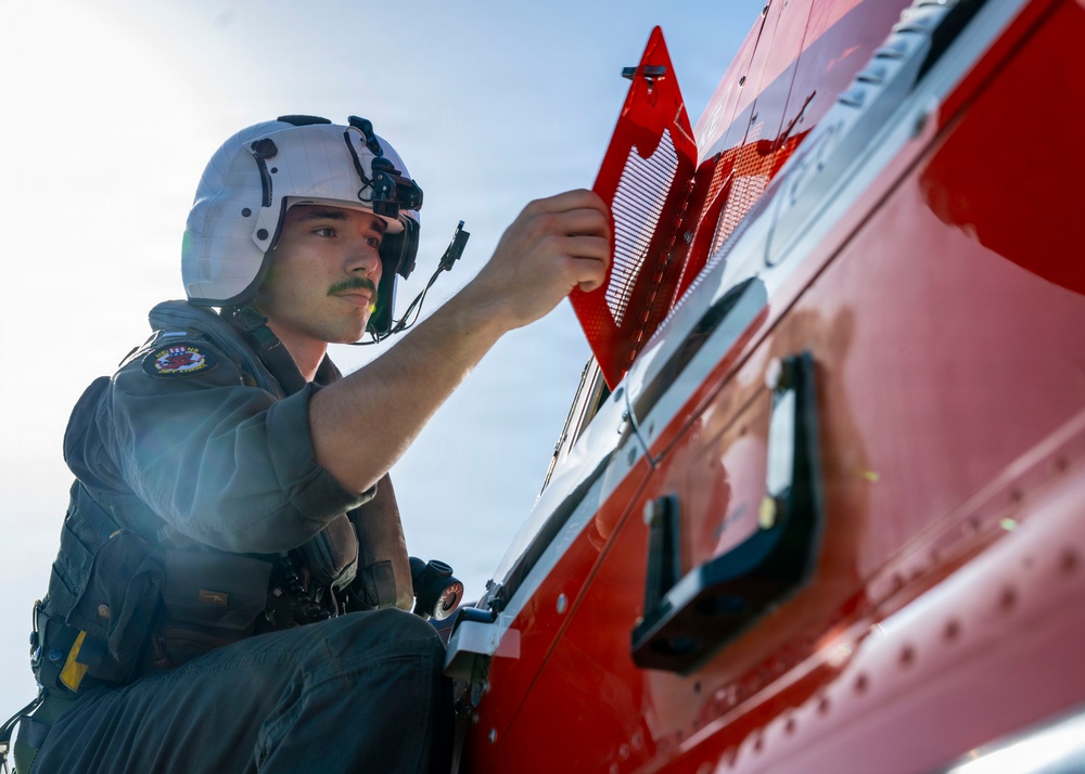 HT-28 Student Naval Aviator Performs Pre-Flight Inspection of TH-73A Thrasher