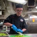 Ronald Reagan Sailors Prepare Food For Taco Tuesday