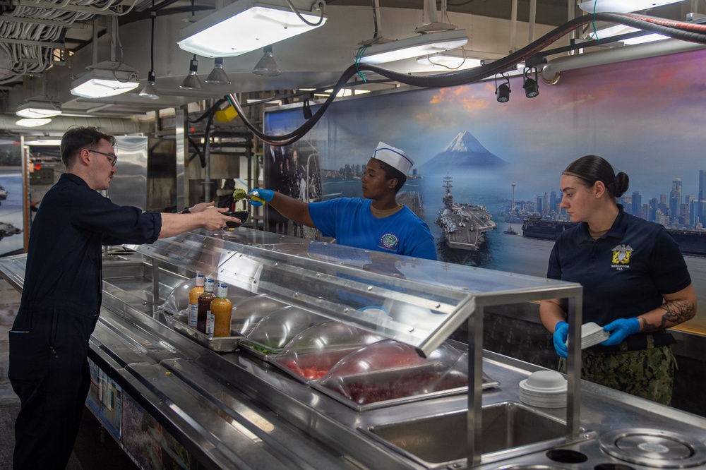 Ronald Reagan Sailors Prepare Food For Taco Tuesday