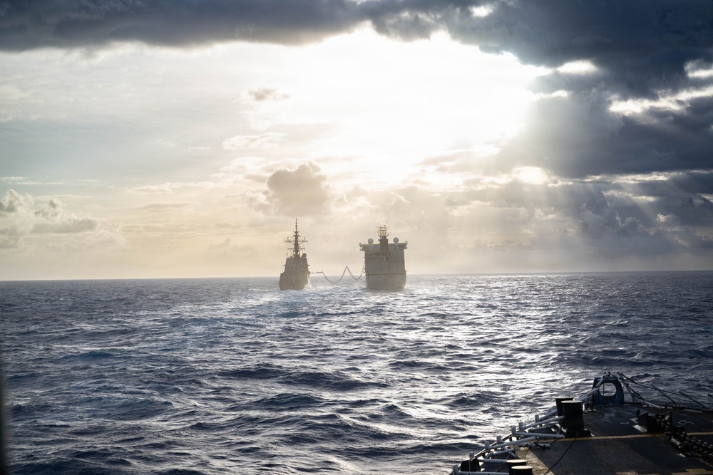 HMCS Regina conducts a replenishment at sea with MV Asterix