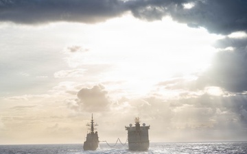 HMCS Regina conducts a replenishment at sea with MV Asterix