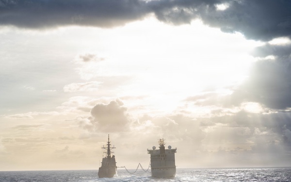 HMCS Regina conducts a replenishment at sea with MV Asterix