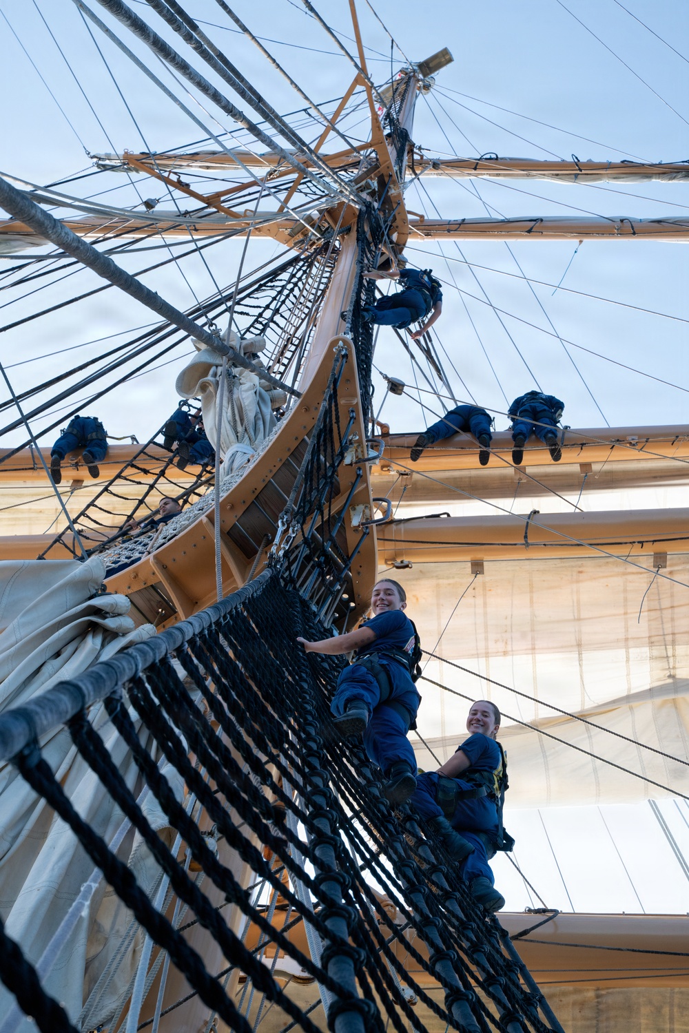 Coast Guard Academy cadets climb Eagle's rigging