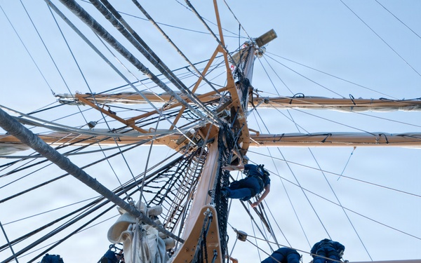 Coast Guard Academy cadets climb Eagle's rigging