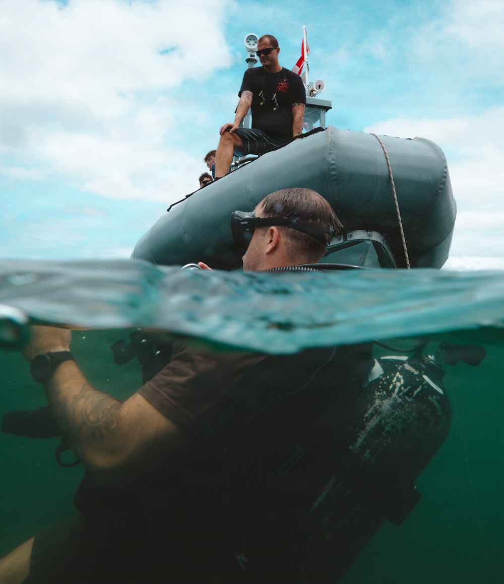 U.S. Navy divers prepare for salvage dive during RIMPAC 2026