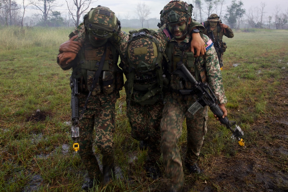 U.S. Army and Malaysian forces join together for a simulated tactical engagement during Keris Strike 26