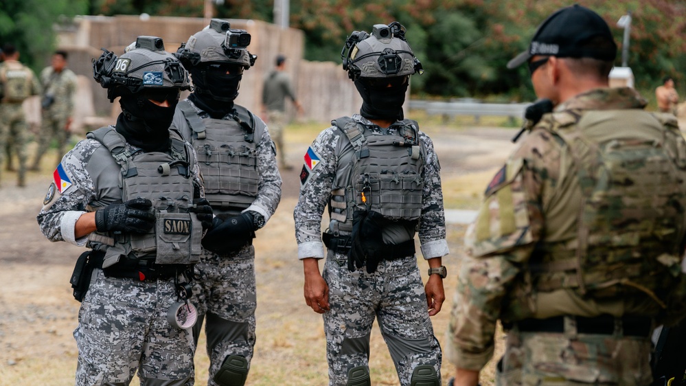 Multinational EOD technicians participate in an IED response drill