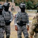 Multinational EOD technicians participate in an IED response drill