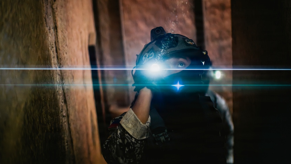 Multinational EOD technicians participate in an IED response drill
