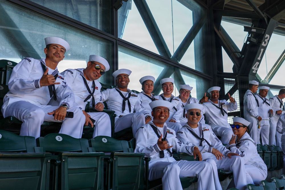 U.S. Navy Sailors attend a Seattle Mariners baseball game during Seattle Fleet Week
