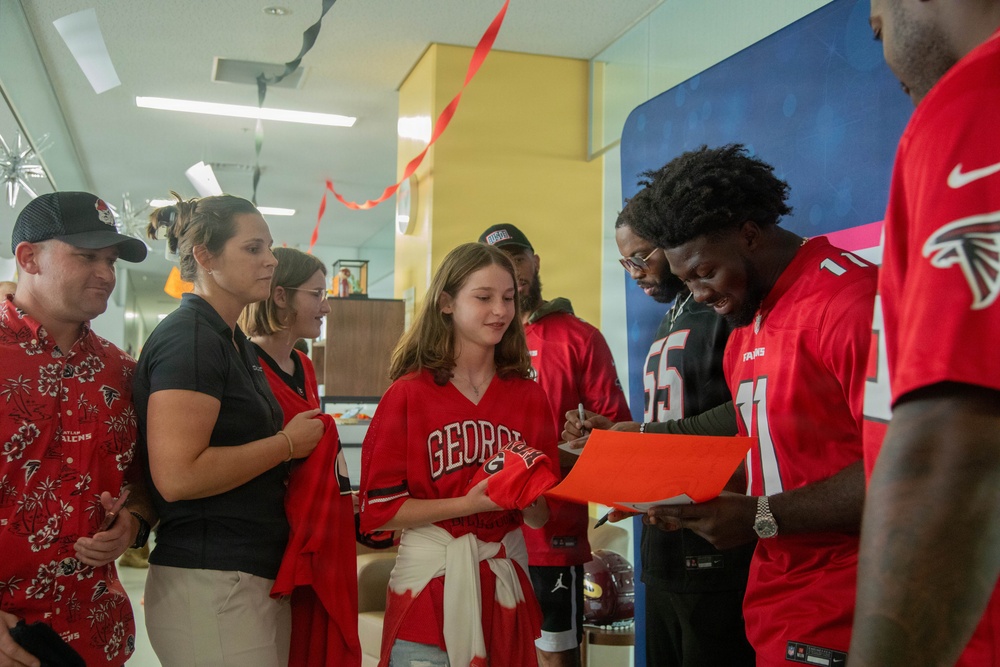 Atlanta Falcon members visit MCAS Iwakuni during a Salute the Troops tour hosted by the USO