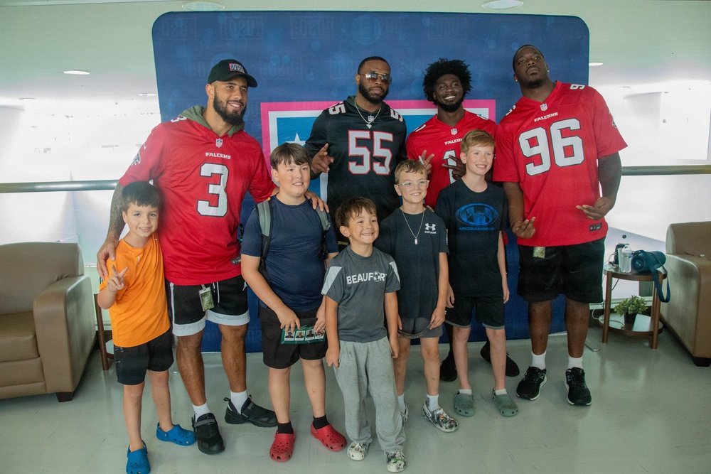 Atlanta Falcon members visit MCAS Iwakuni during a Salute the Troops tour hosted by the USO