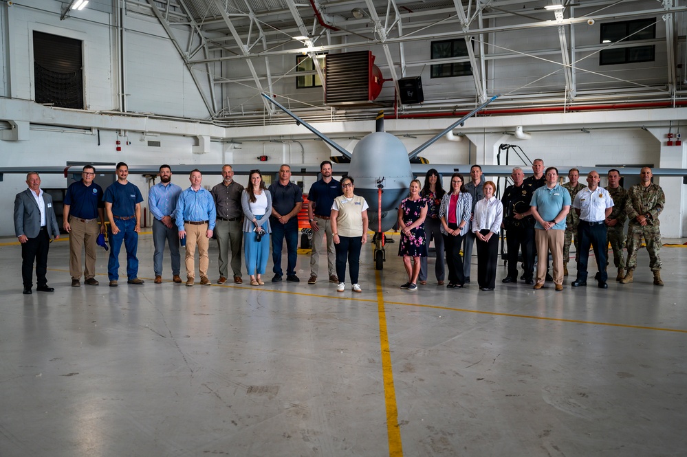 Employers Pose with MQ-9 Reaper During ESGR Boss Day