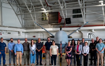Employers Pose with MQ-9 Reaper During ESGR Boss Day
