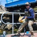 U.S. Navy Chief Mineman Matthew Dowlen secures a mooring line to a cleat during Seabreeze26