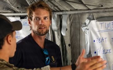 U.S. Navy and Swedish EOD members discuss mine clearance safety during Seabreeze26