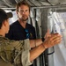 U.S. Navy and Swedish EOD members discuss mine clearance safety during Seabreeze26