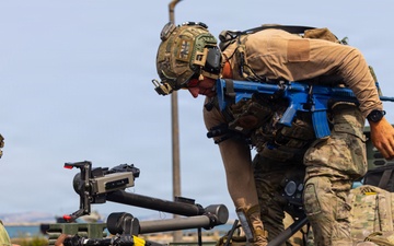 U.S. Navy EODMU 8 member load the Manned Transport Robot System (MTRS) during Seabreeze26