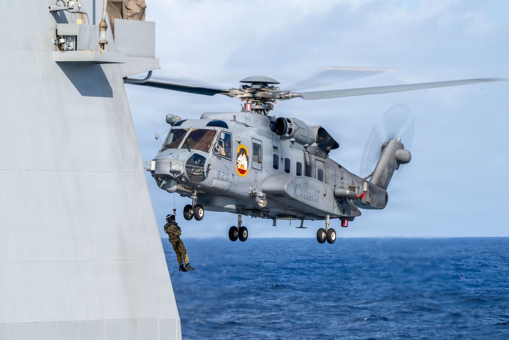 Canadian and New Zealand sailors conduct vertical replenishment training during RIMPAC 2026