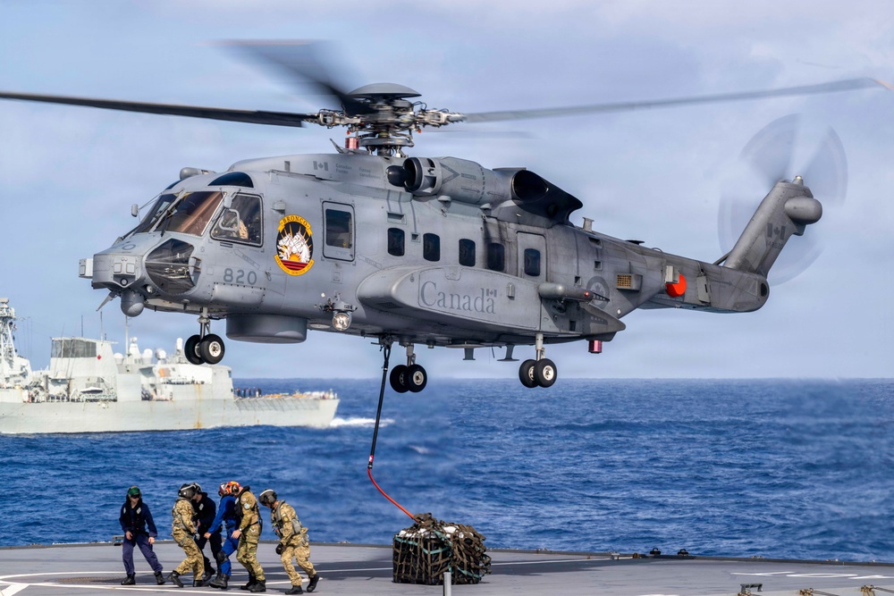 Canadian and New Zealand sailors conduct vertical replenishment training during RIMPAC 2026