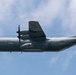 A U.S. Air Force C-130 Hercules military transport aircraft is photographed in flight against a partly cloudy sky. The aircraft belongs to the West Virginia Air National Guard, as indicated by markings on the fuselage. The tail displays the nickname 'Charlie West' and the serial number 85914.