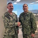 Acting SG Presents Sailor with Coin