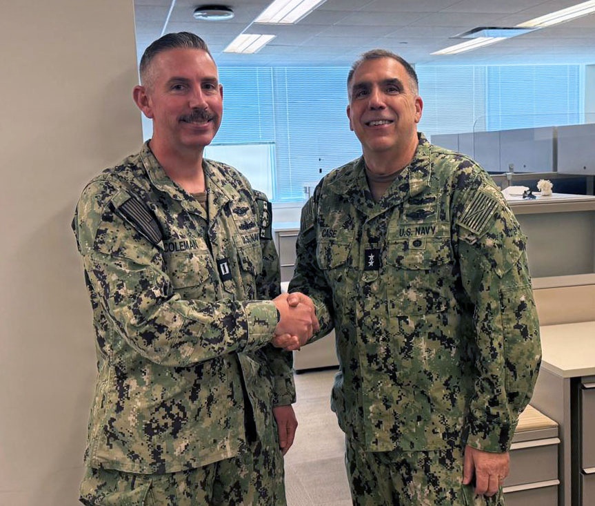 Acting SG Presents Sailor with Coin