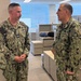 Acting SG Presents Sailor with Coin