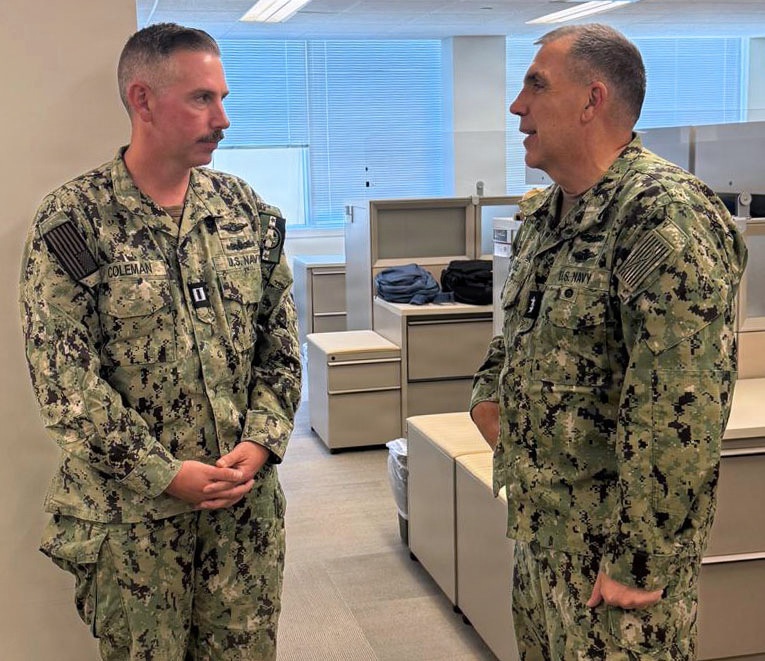 Acting SG Presents Sailor with Coin