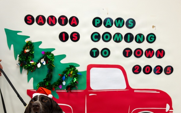 Military Working Dogs from Tinker Air Force Base and two Transportation Security Administration dress as "Santa Paws"