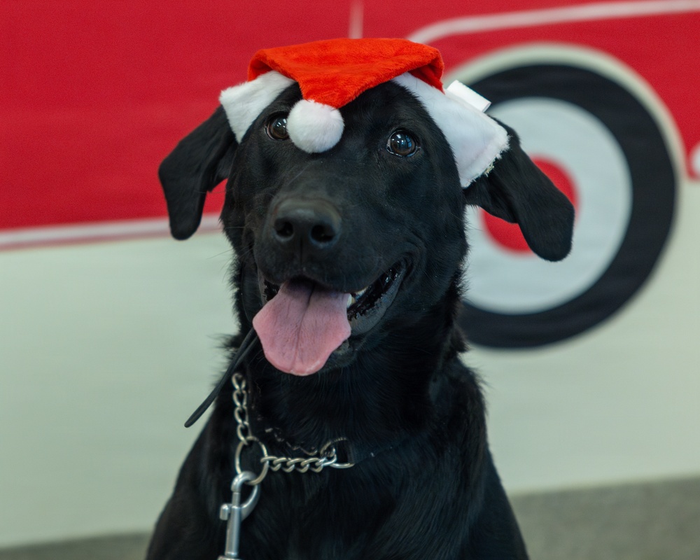 Military Working Dogs from Tinker Air Force Base and two Transportation Security Administration dress as "Santa Paws"