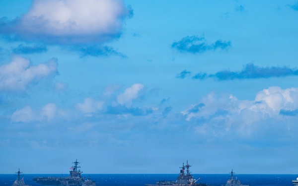 Partner nations participate in group sail lead by the USS Theodore Roosevelt during RIMPAC 26