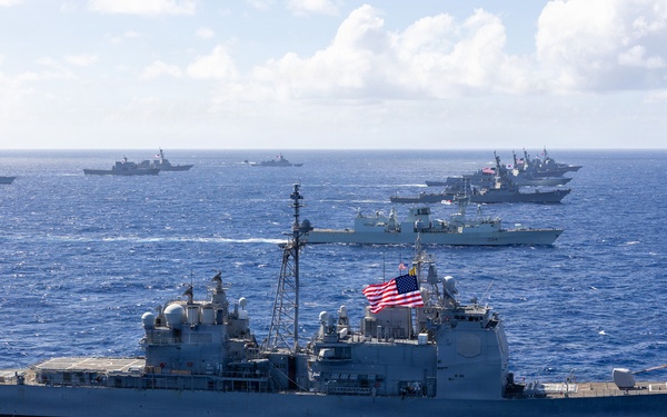 Multinational ships sail in formation during RIMPAC 2026