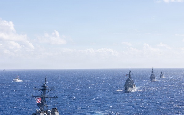 Multinational ships sail in formation during RIMPAC 2026