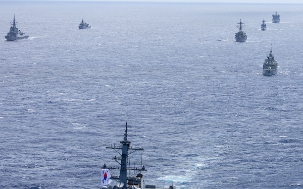 Multinational ships sail in formation during RIMPAC 2026