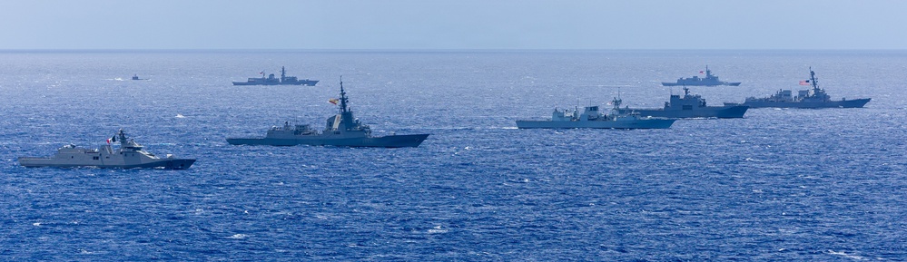 Multinational ships sail in formation during RIMPAC 2026