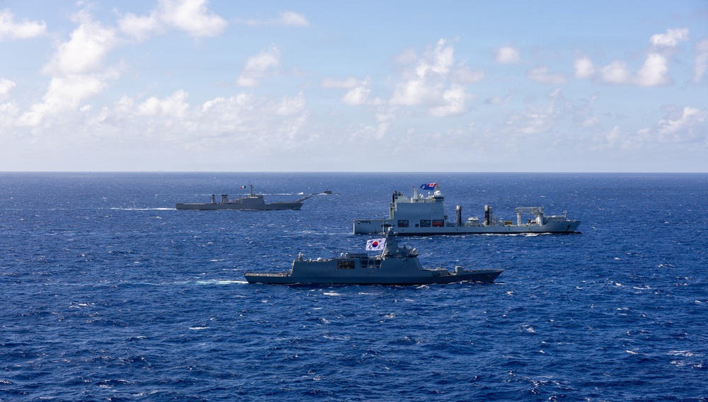 Multinational ships sail in formation during RIMPAC 2026