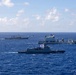 Multinational ships sail in formation during RIMPAC 2026