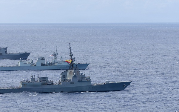 Multinational ships sail in formation during RIMPAC 2026