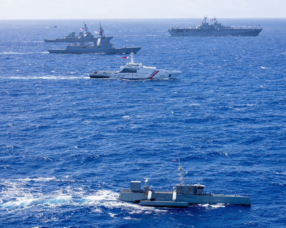 Multinational ships sail in formation during RIMPAC 2026