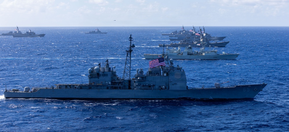 Multinational ships sail in formation during RIMPAC 2026