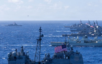 Multinational ships sail in formation during RIMPAC 2026