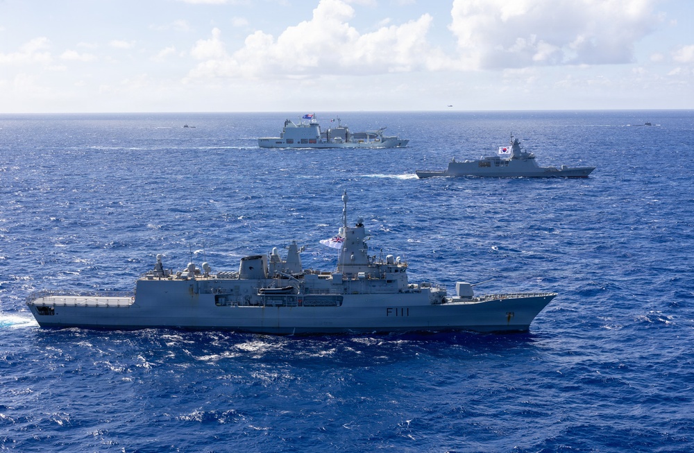 Multinational ships sail in formation during RIMPAC 2026