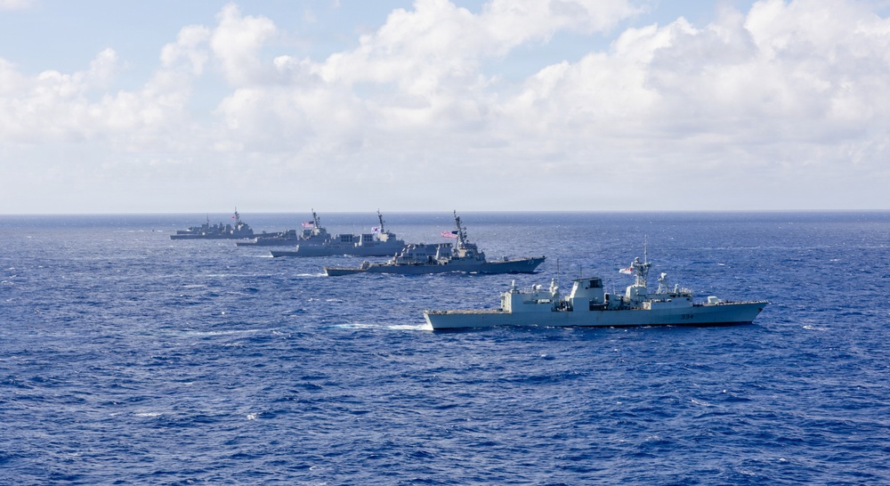 Multinational ships sail in formation during RIMPAC 2026